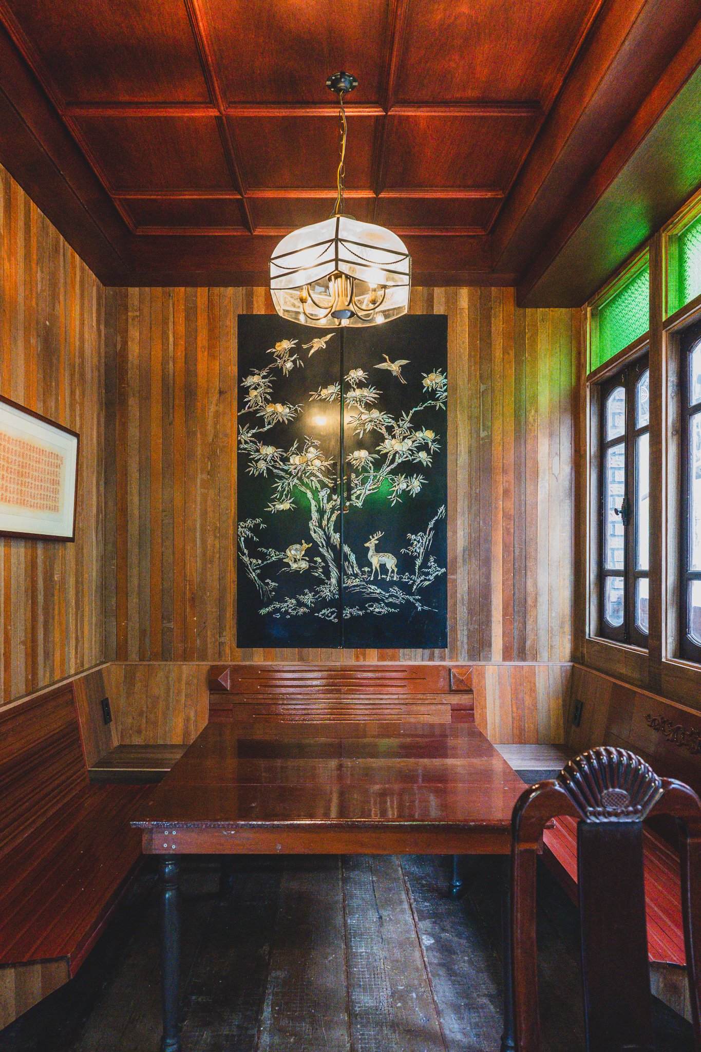 One of the second-floor rooms, furnished with a mother-of-pearl inlaid folding screen and antique-style seating