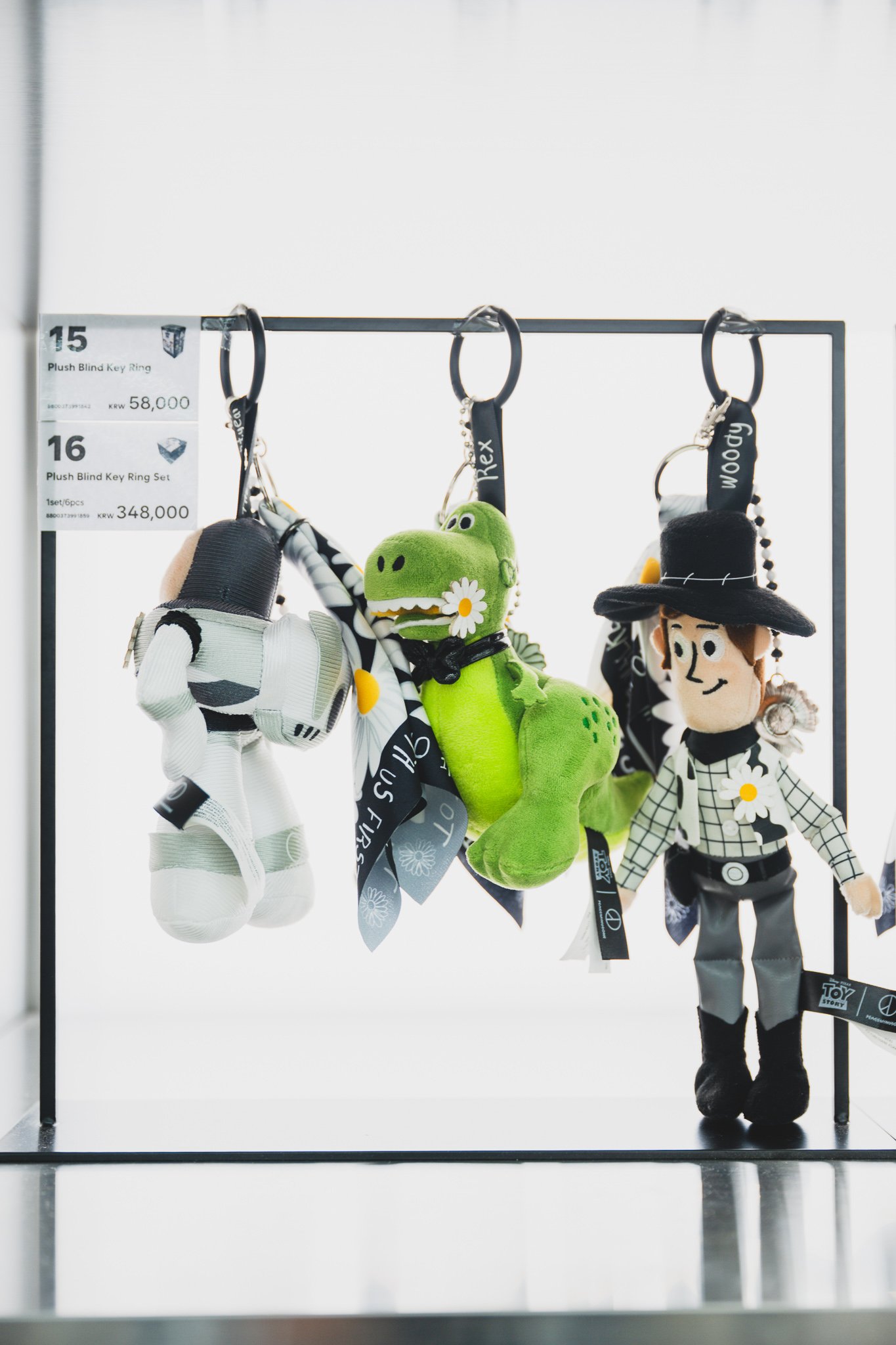 A set of plush character keyrings with pricing displayed
