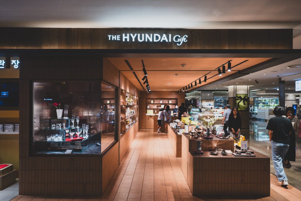 Storefront of The Hyundai Gift inside Hyundai Department Store's Trade Center branch, with crystal glassware displayed in a lit case