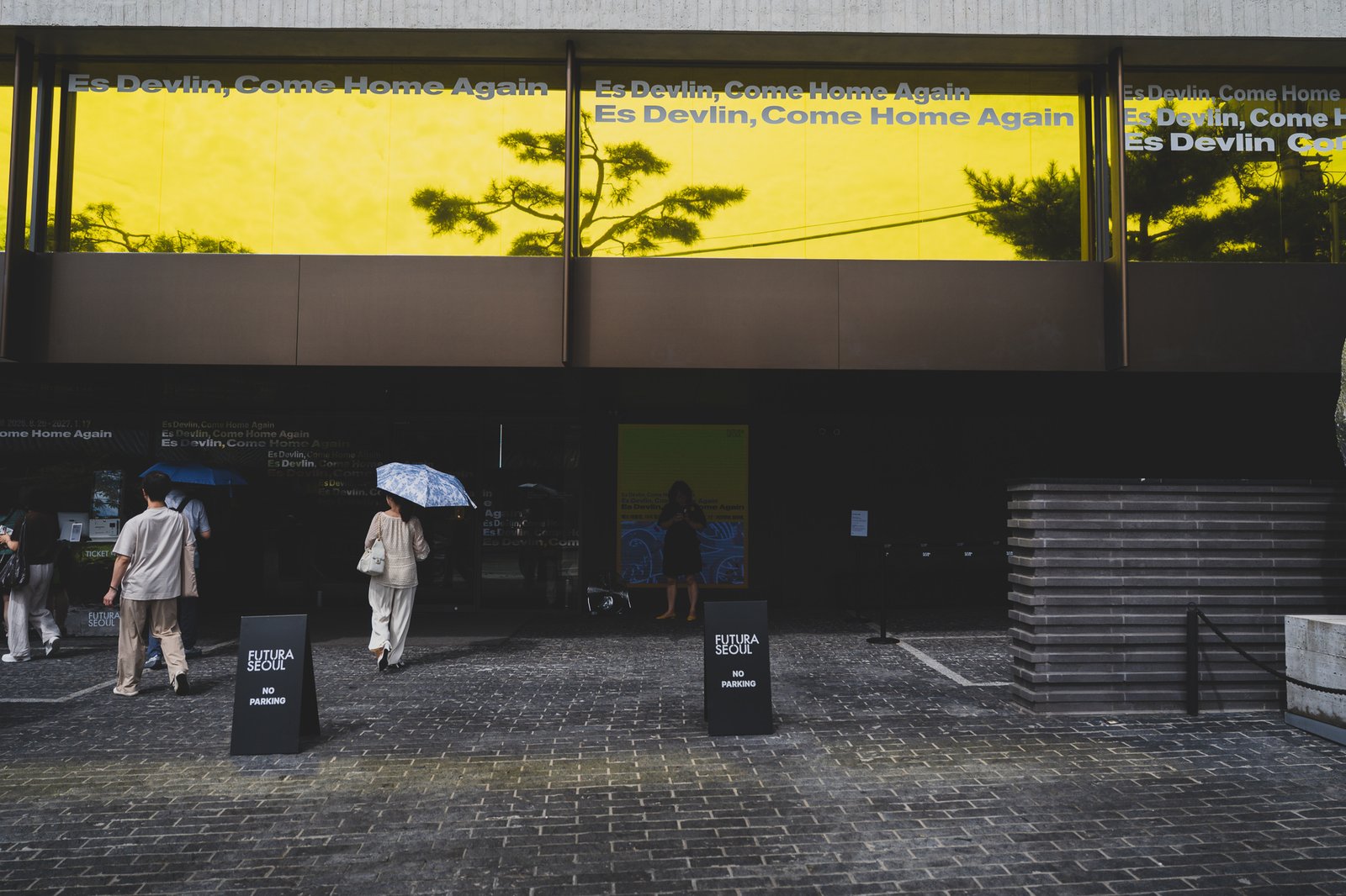 Exterior of Futura Seoul with "Es Devlin, Come Home Again" signage over the entrance
