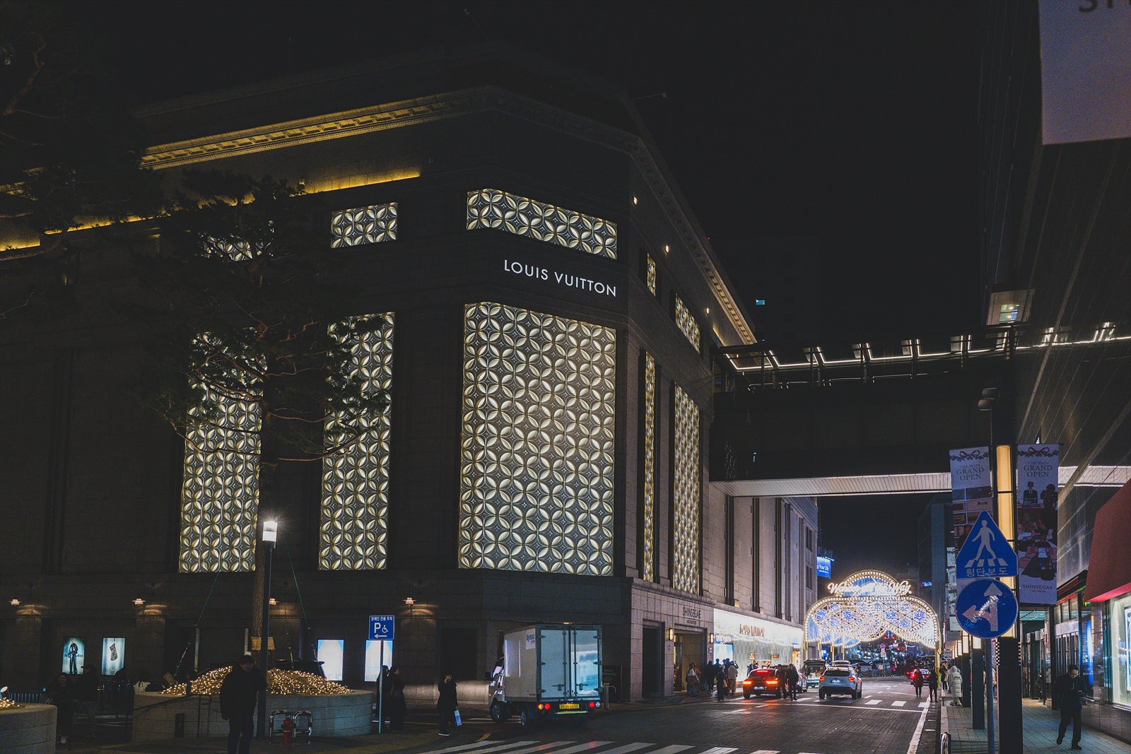 Louis Vuitton's flagship building at Shinsegae The Reserve lit up at night in Myeongdong, Seoul