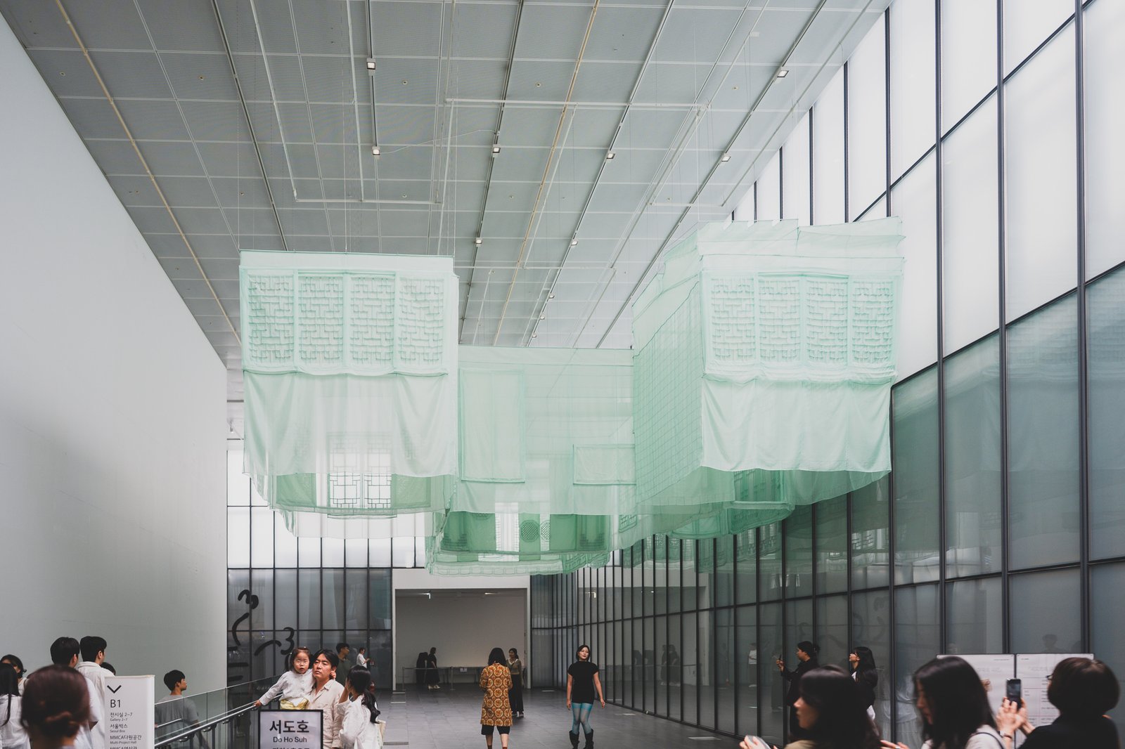 Fabric hanok ceiling installation in the museum lobby, visible without a ticket