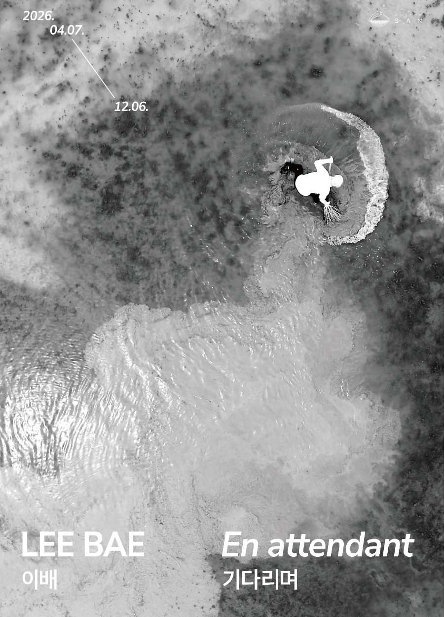 Official poster for Lee Bae's "En attendant" exhibition at Museum SAN, a black-and-white aerial photograph of a figure and charcoal-toned water pattern