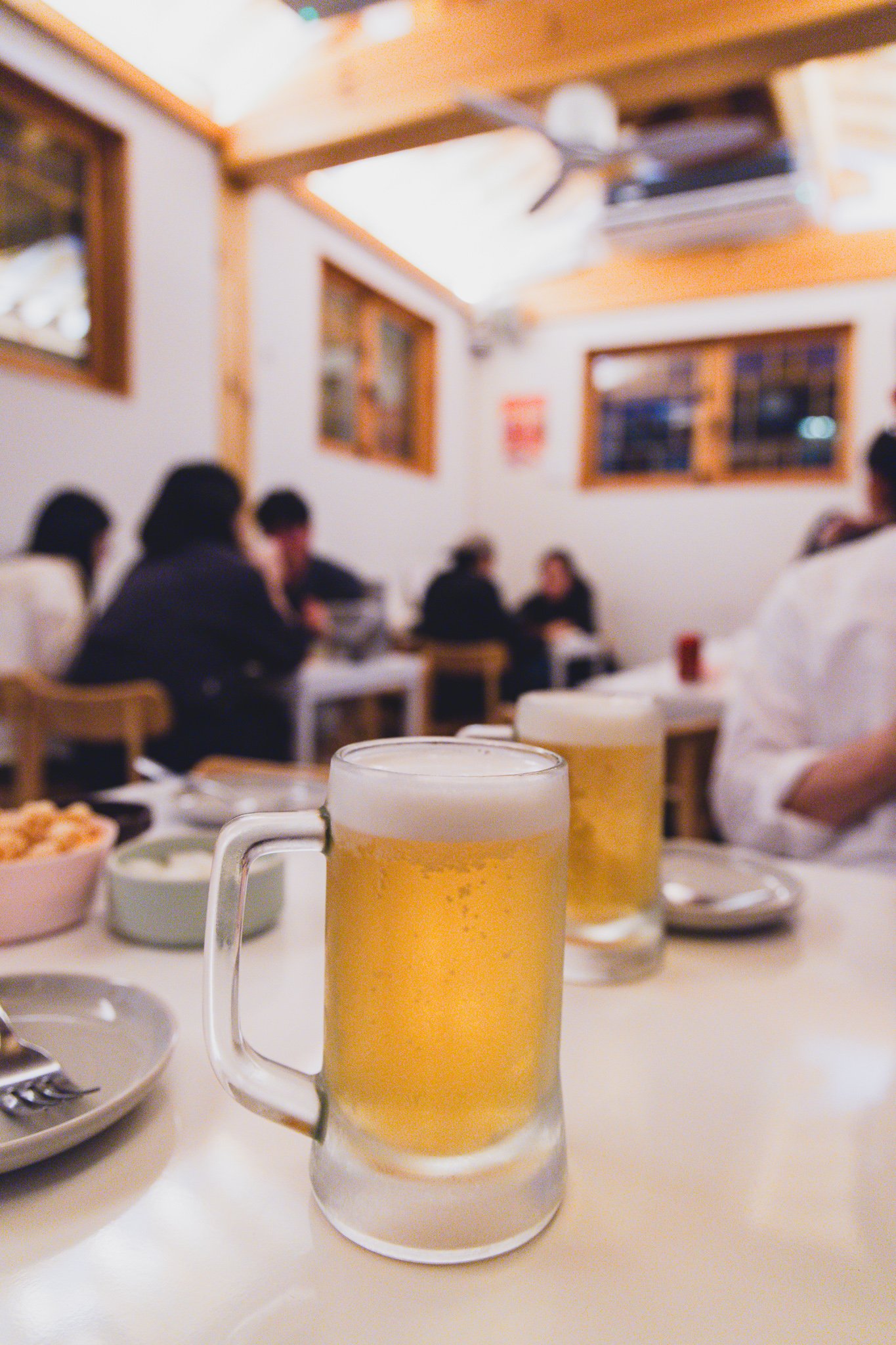 Two glasses of draft beer on the table