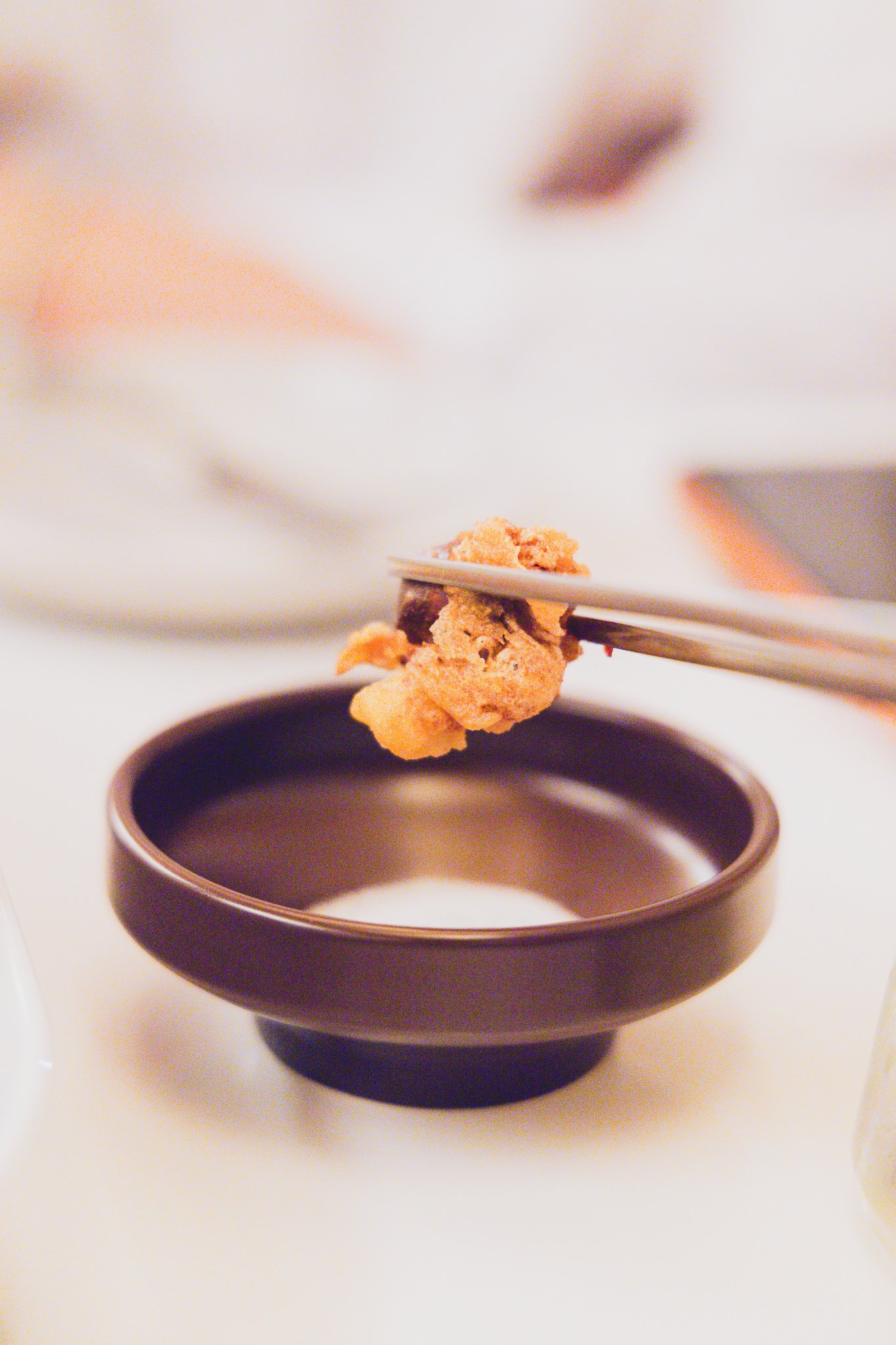 Close-up of fried gizzards on a fork