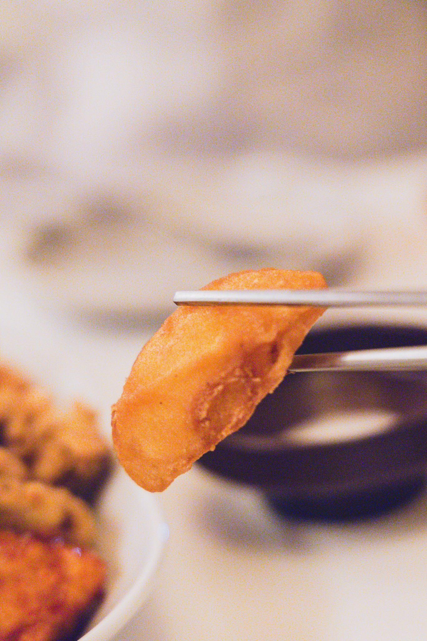 Close-up of fries on a fork