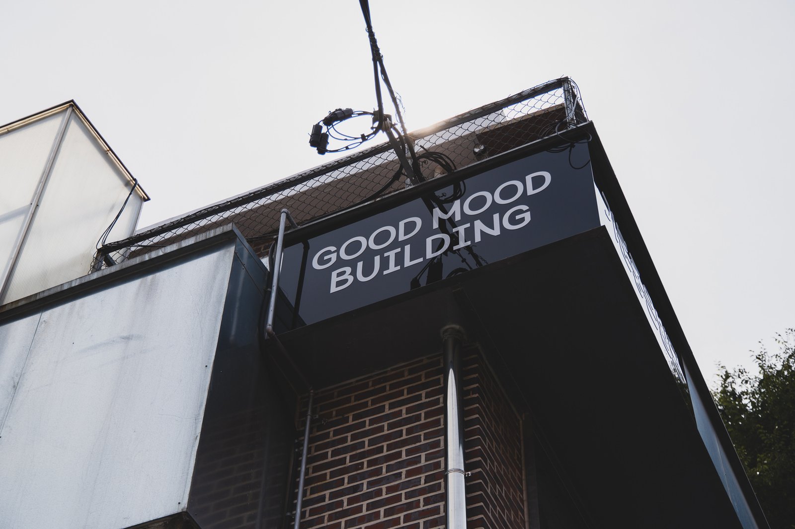 Corner signage for "GOOD MOOD BUILDING," the building where oh lolly day's Seoul Forest store is located