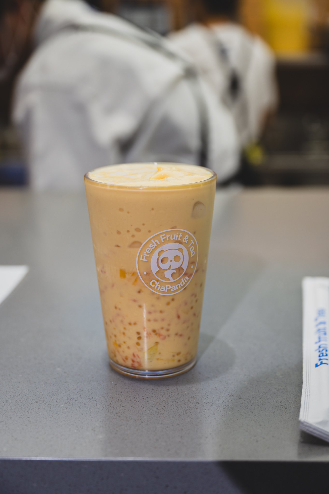 Close-up of the Mango Pomelo Sago, with mango flesh and red pomelo grains layered in the cup