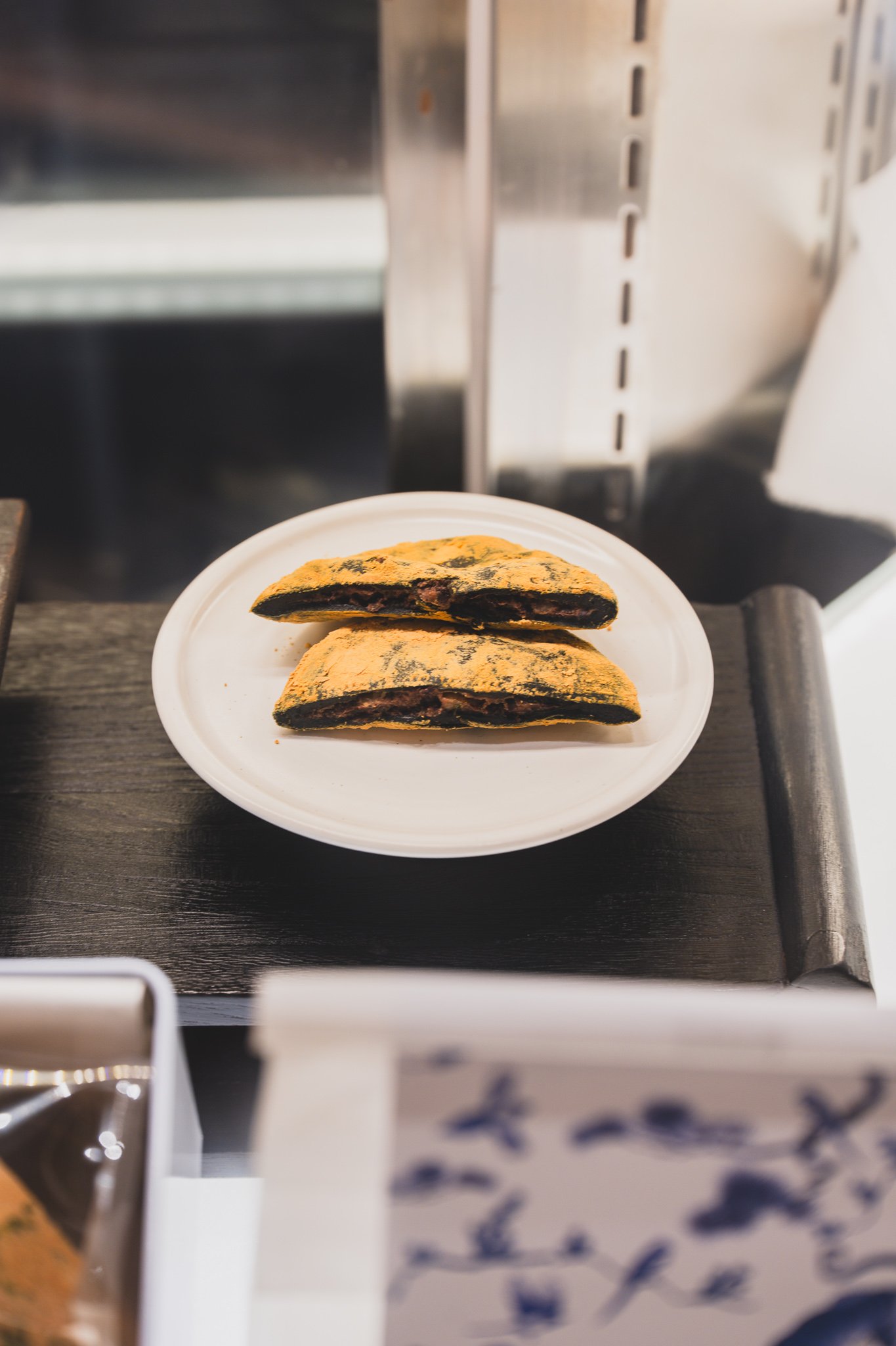 Rice cake cut in half, showing red bean paste filling the entire interior