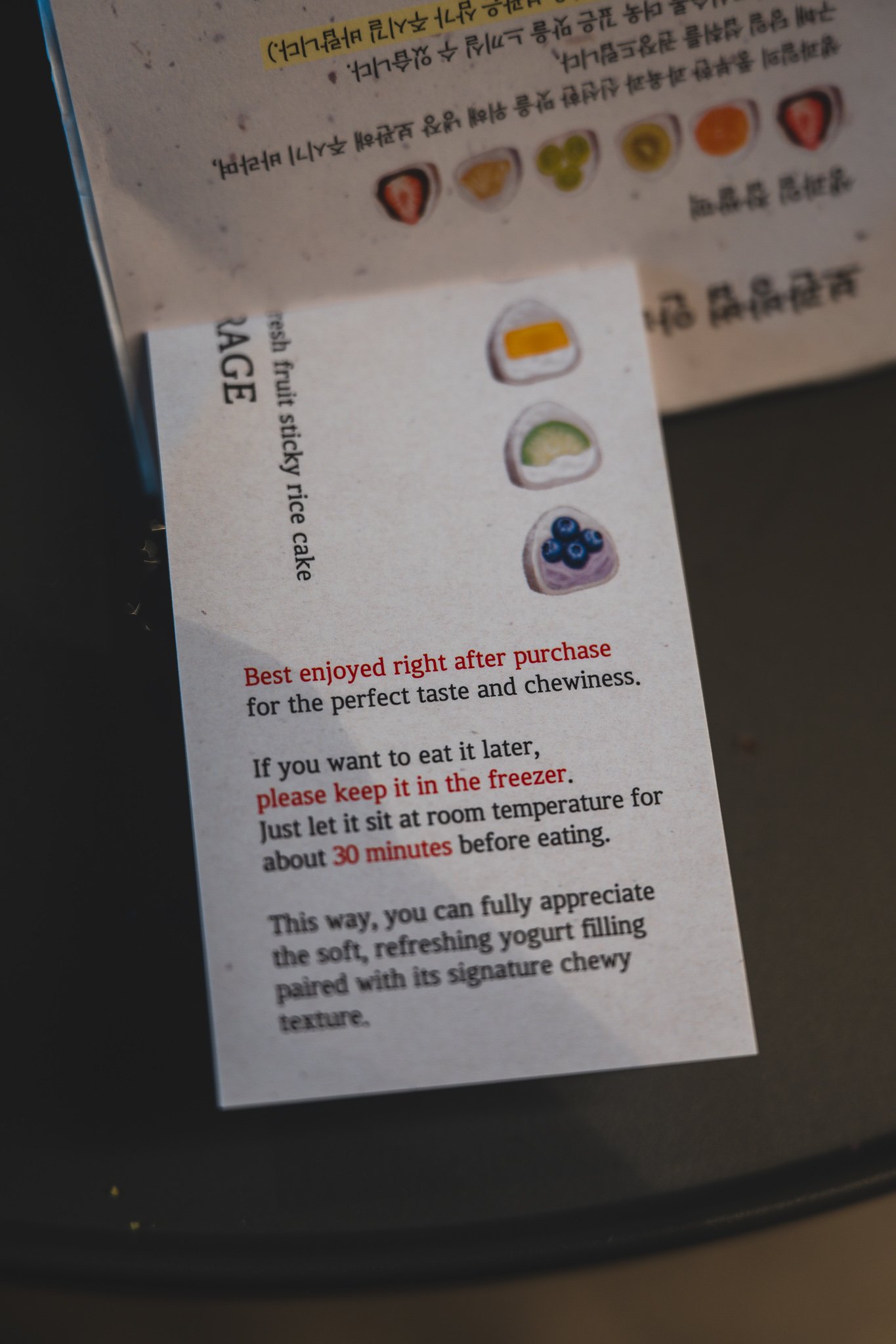 English-language storage instructions card recommending immediate consumption or freezing with a 30-minute thaw