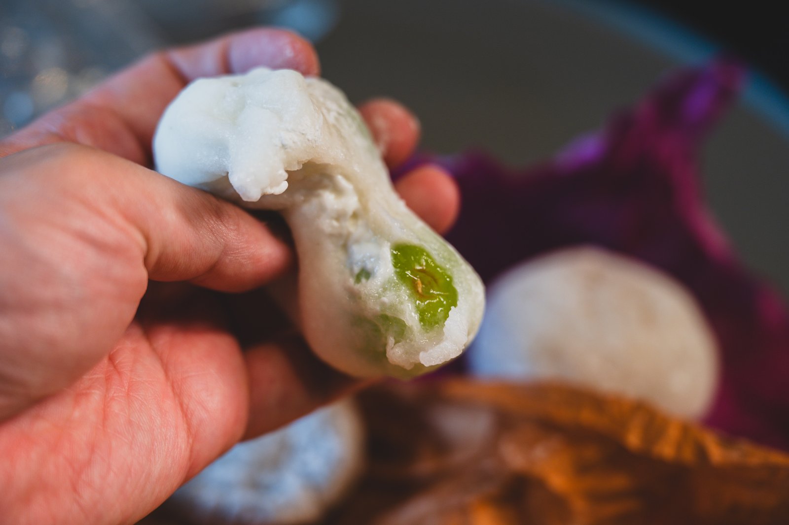 Cross-section of the shine muscat Greek yogurt mochi, showing the yogurt cream and a whole grape inside