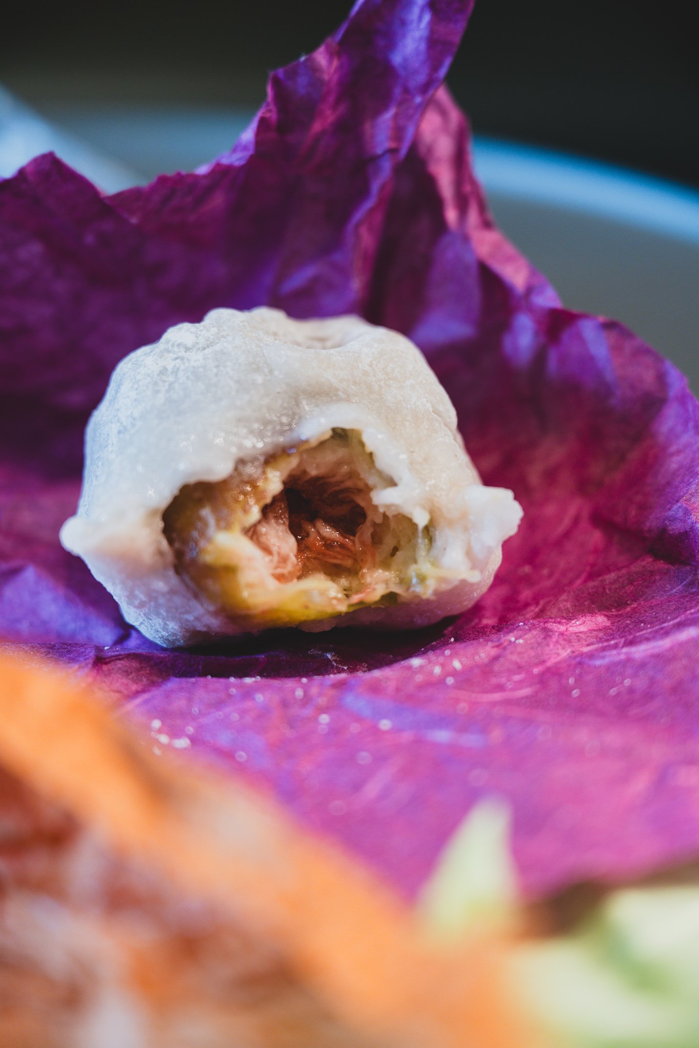 Cross-section of the fig mochi showing the reddish-purple fig filling