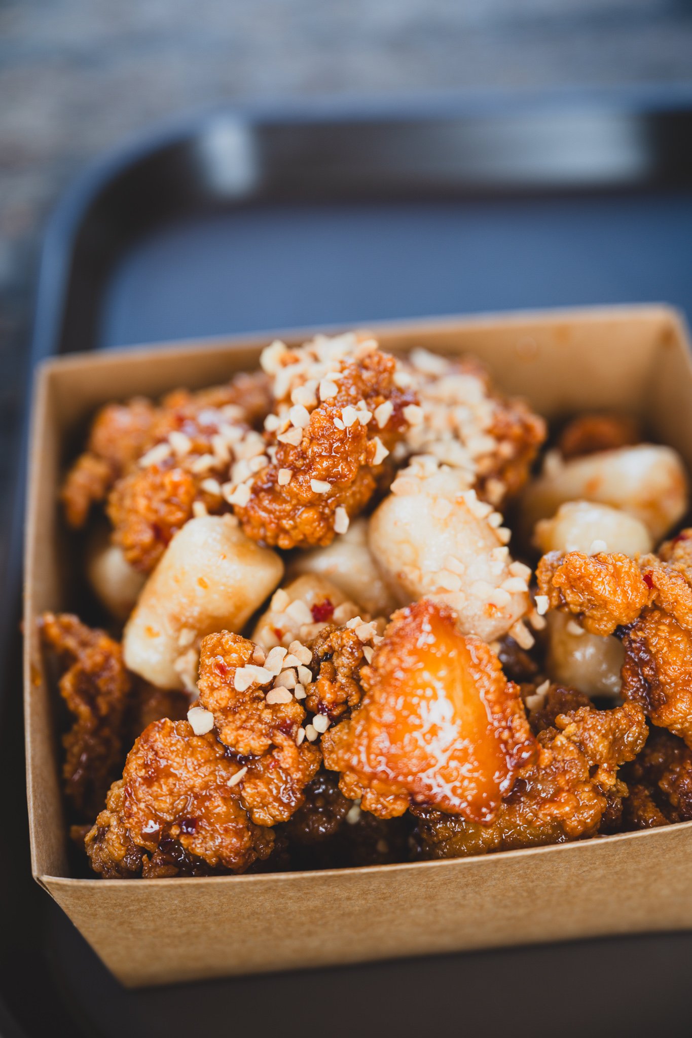 Dakgangjeong topped with peanut crumble