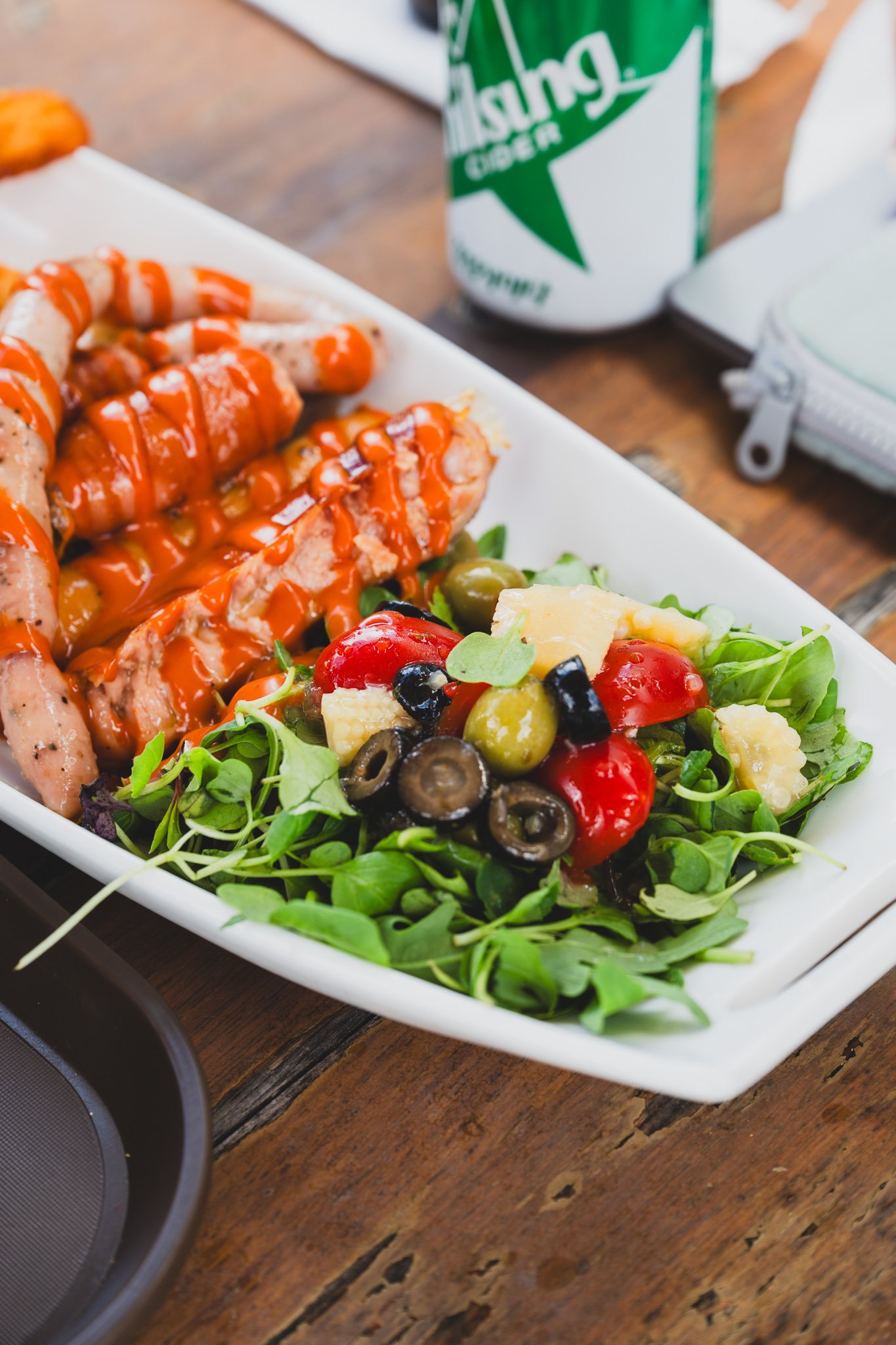 Sausage and wedge fries platter with a side salad