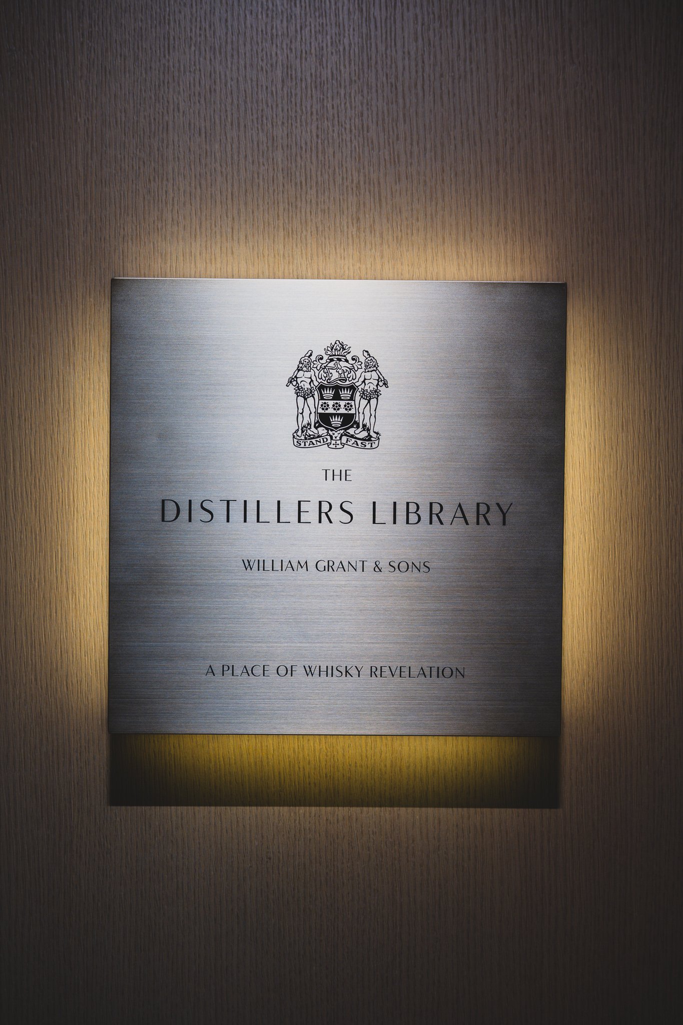 Entrance plaque reading "A Place of Whisky Revelation" at The Distiller's Library
