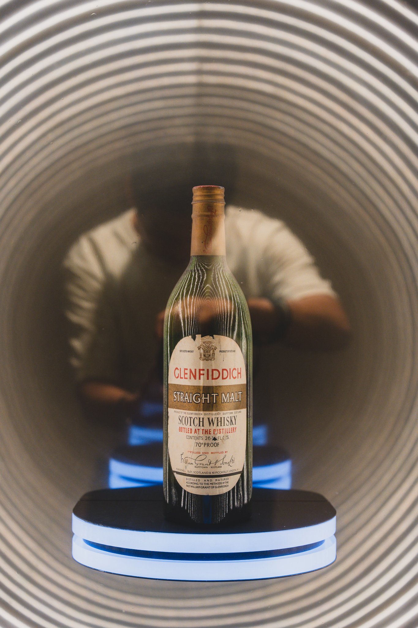 Vintage Glenfiddich Straight Malt bottle displayed in a cylindrical case