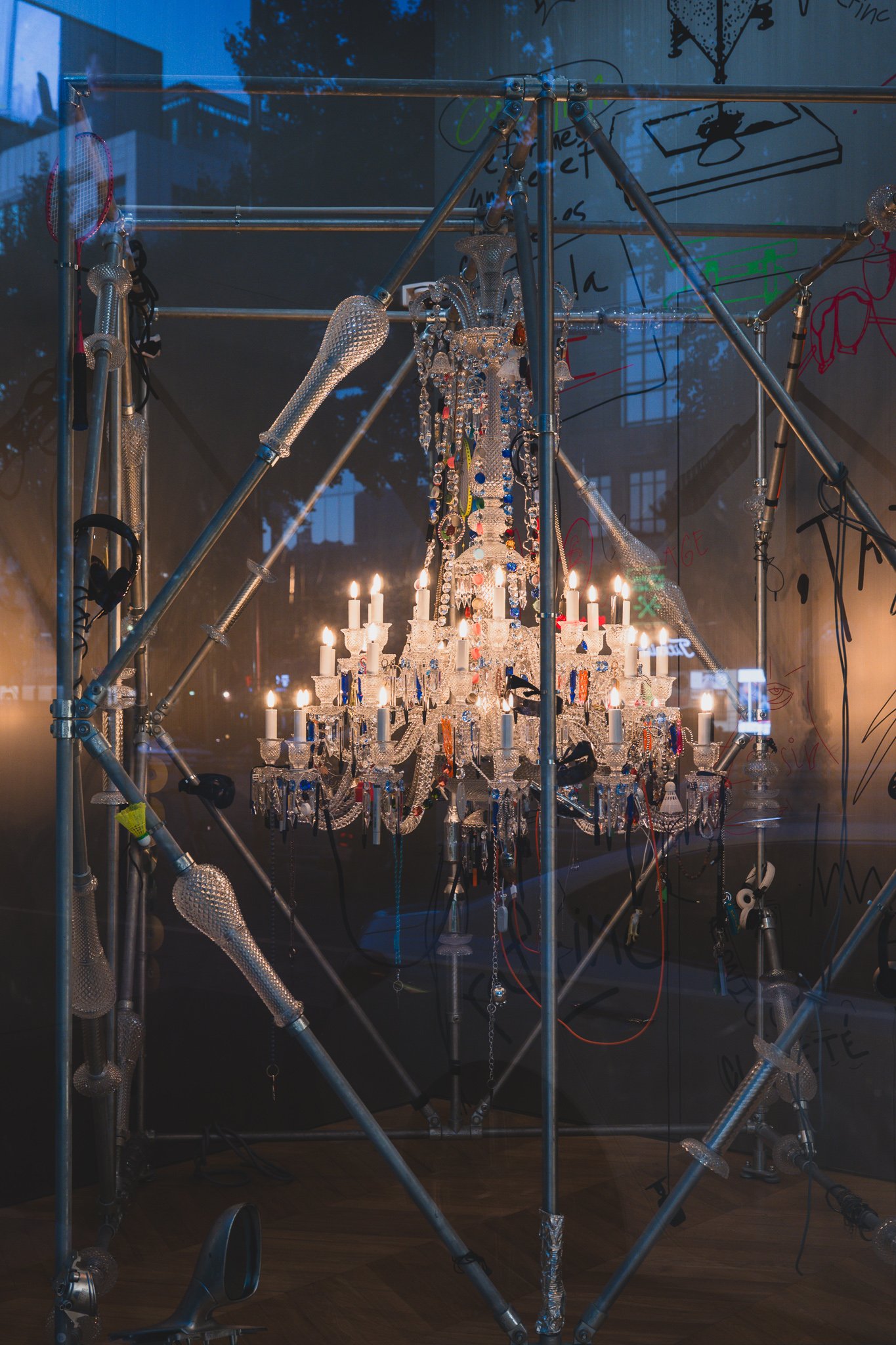 Harry Nuriev's reinterpreted Zénith chandelier, its crystal arms hung with roughly 250 everyday objects instead of crystal drops