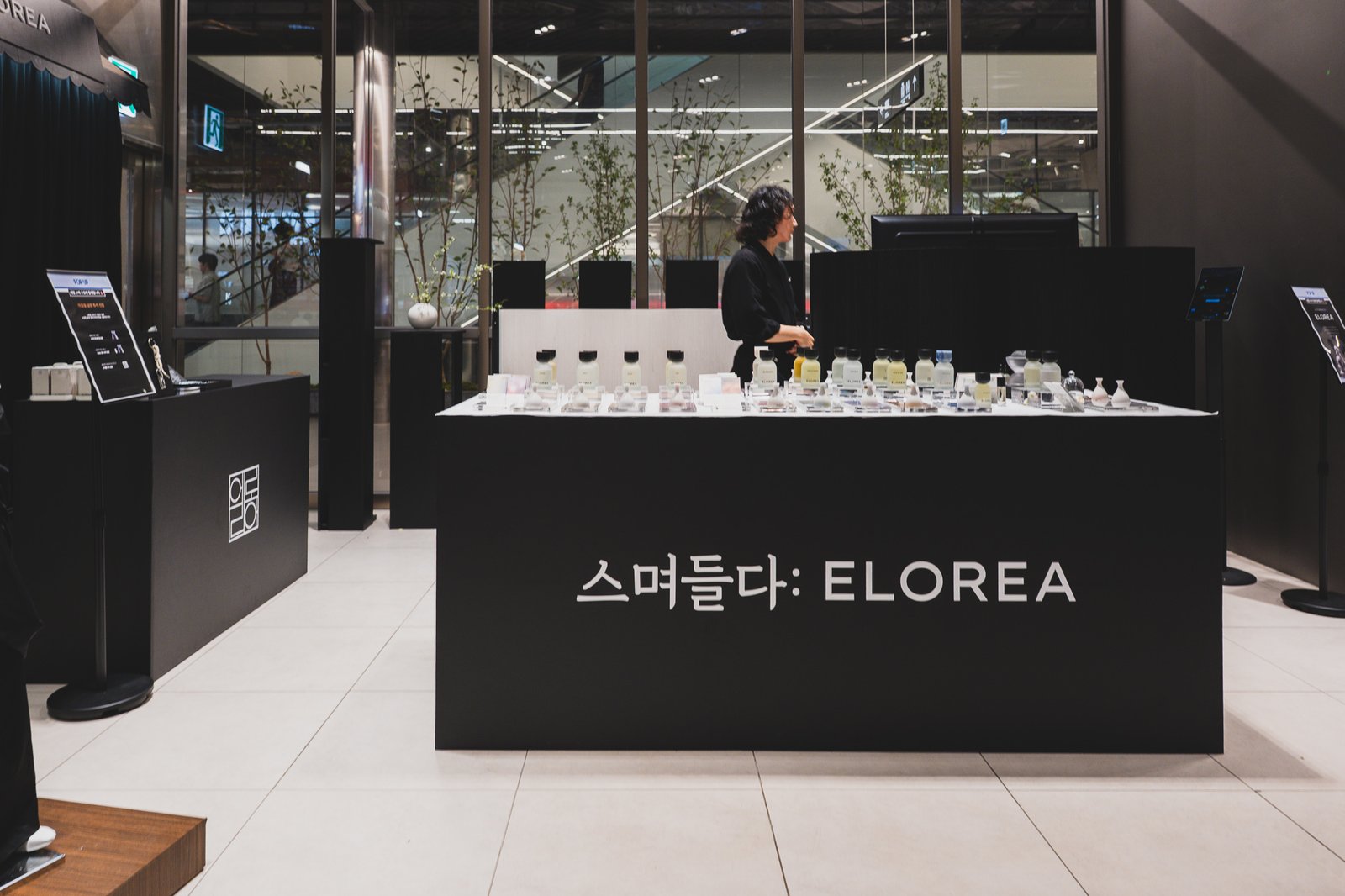 ELOREA counter with translucent perfume bottles lit from below