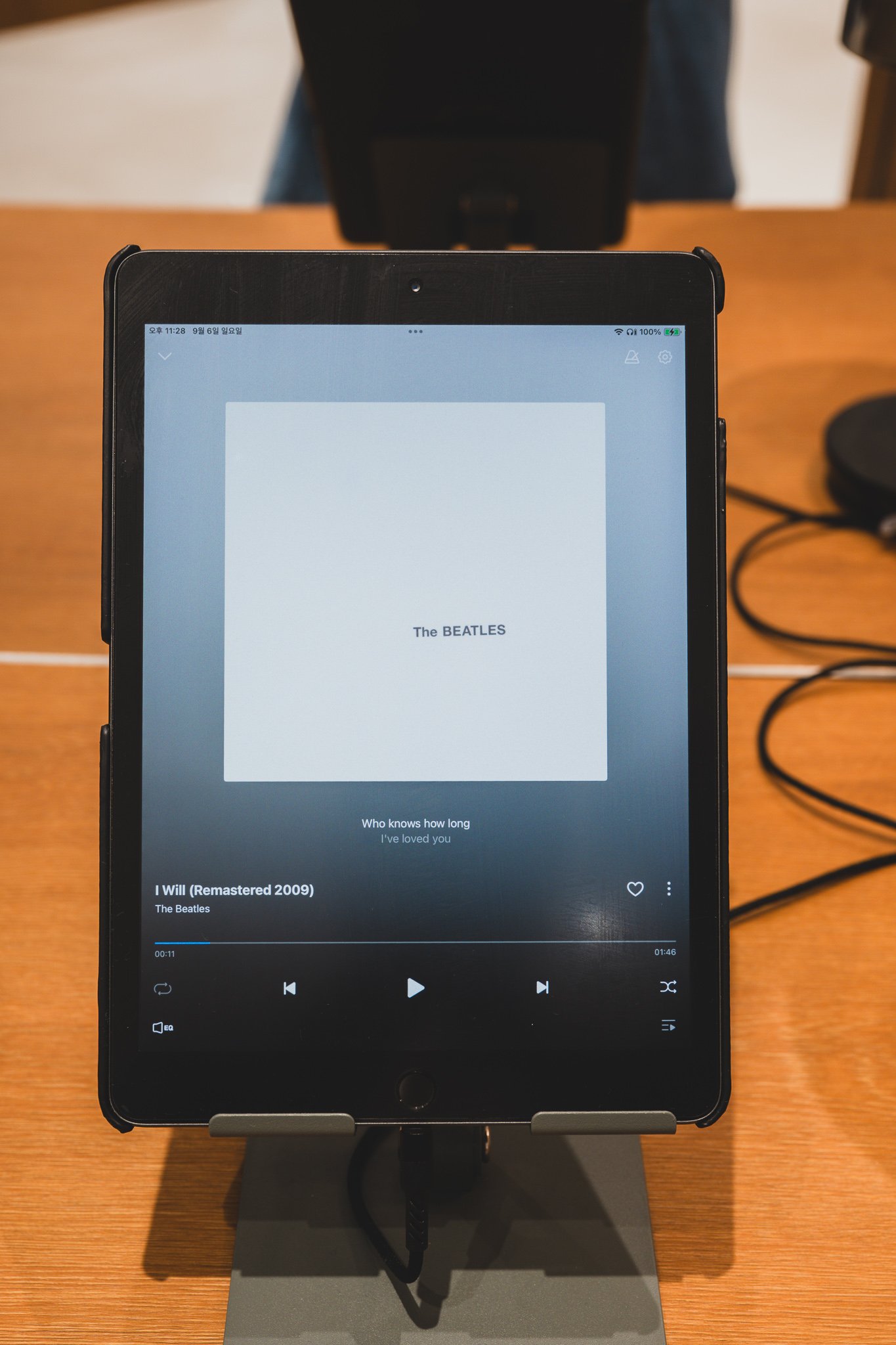 Tablet screen playing "I Will (Remastered 2009)" on the Genie Music app