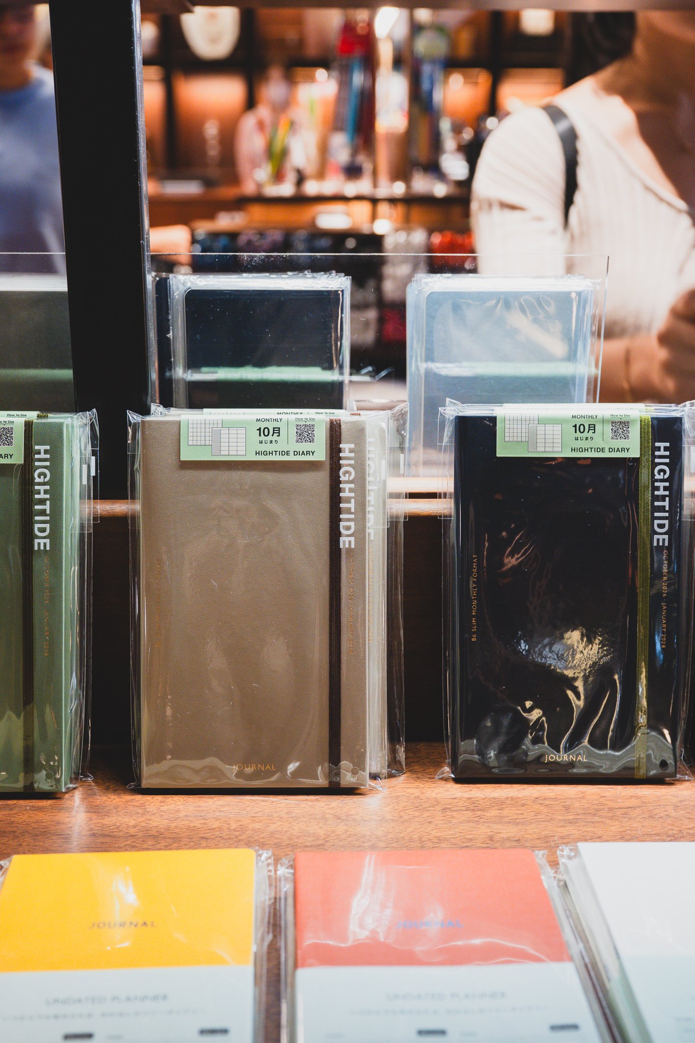 HighTide Diary's October-start monthly planners in khaki, beige, and black