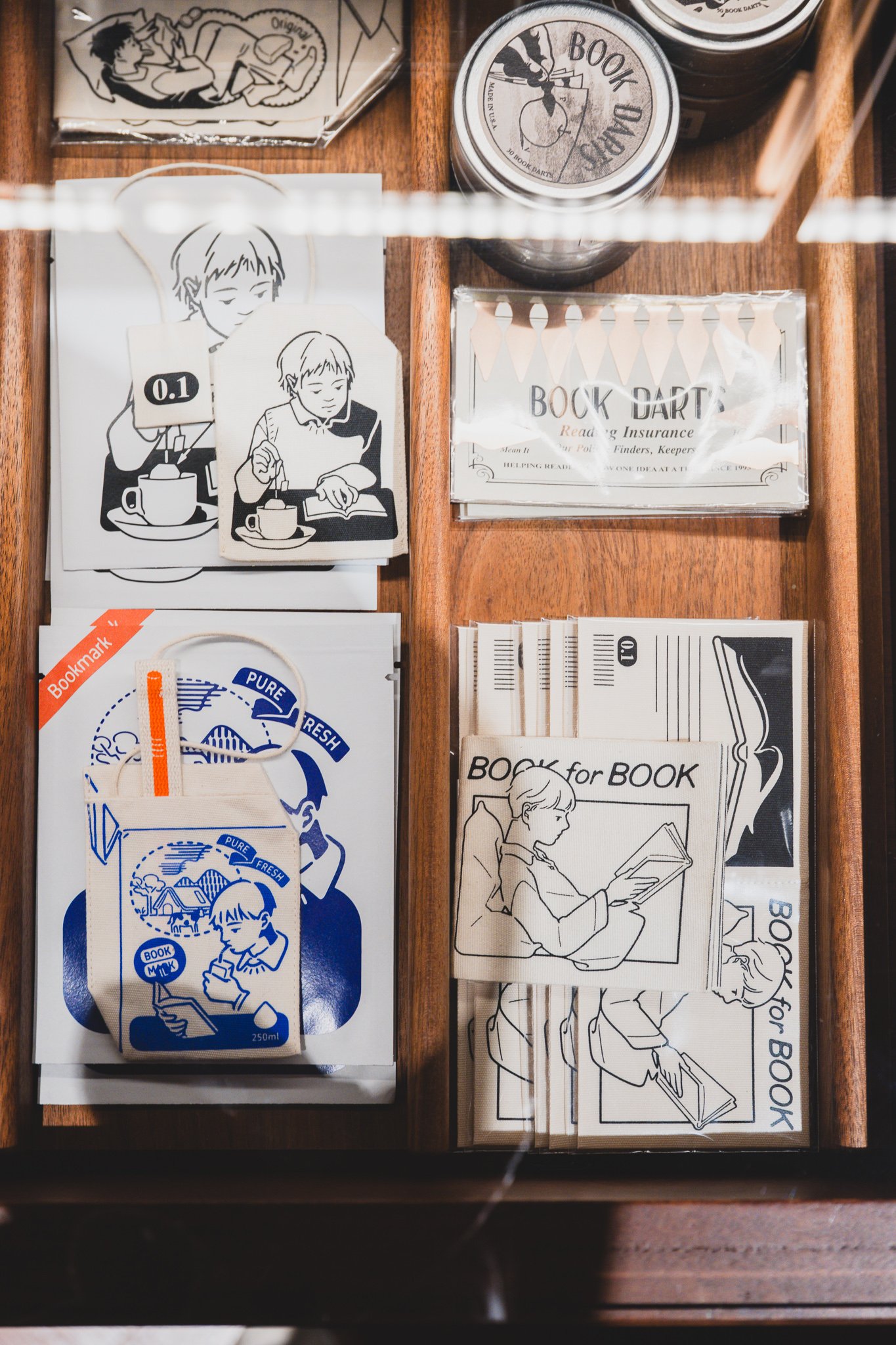 Book Darts and illustrated bookmarks, including a milk-carton-shaped fabric marker