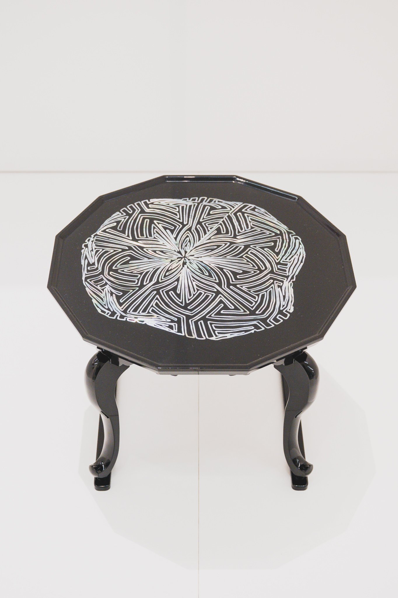 Afterimage table with maze-like holographic mother-of-pearl pattern