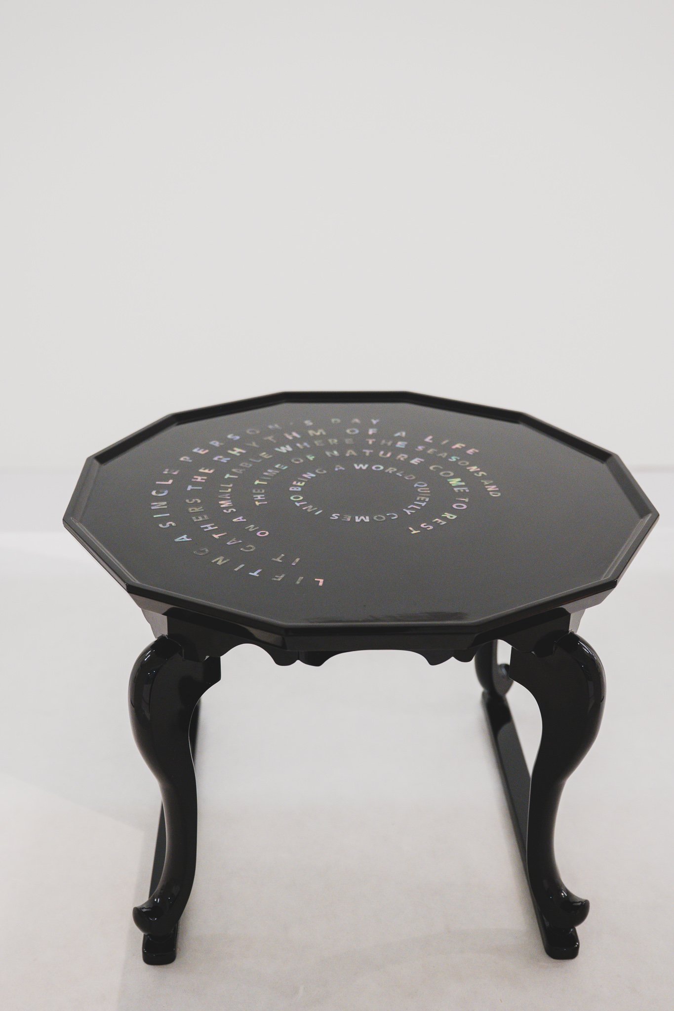 Microcosmo table with spiral mother-of-pearl text inlay