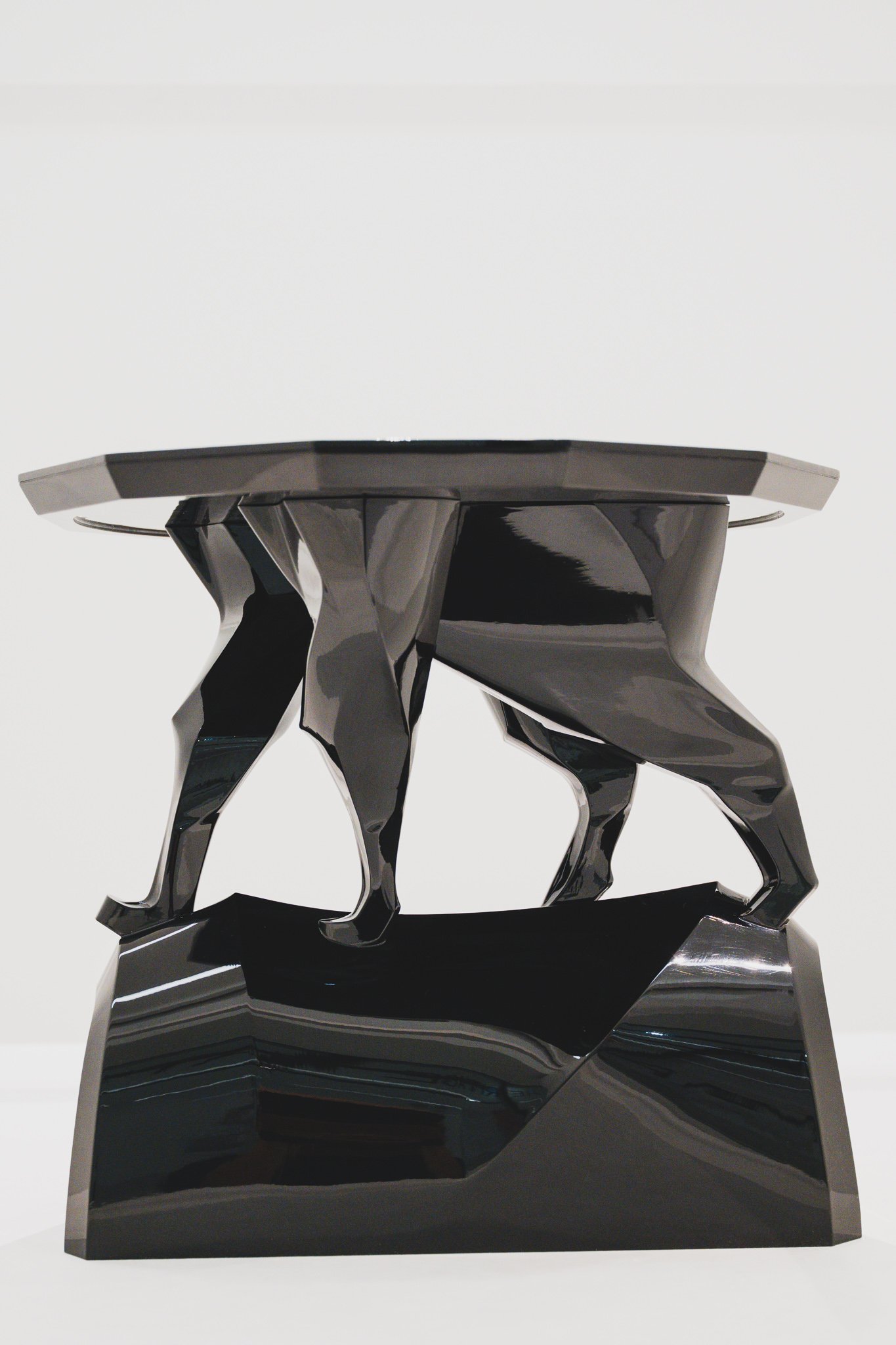 Cat-Leg Soban table with sharp angular black metallic legs