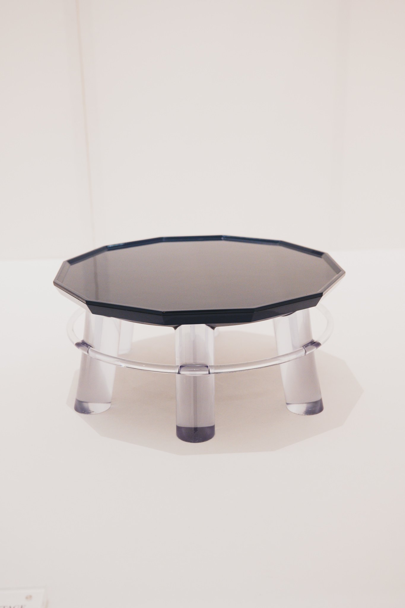 Floating Heritage table with crystal top appearing to float on clear acrylic ring