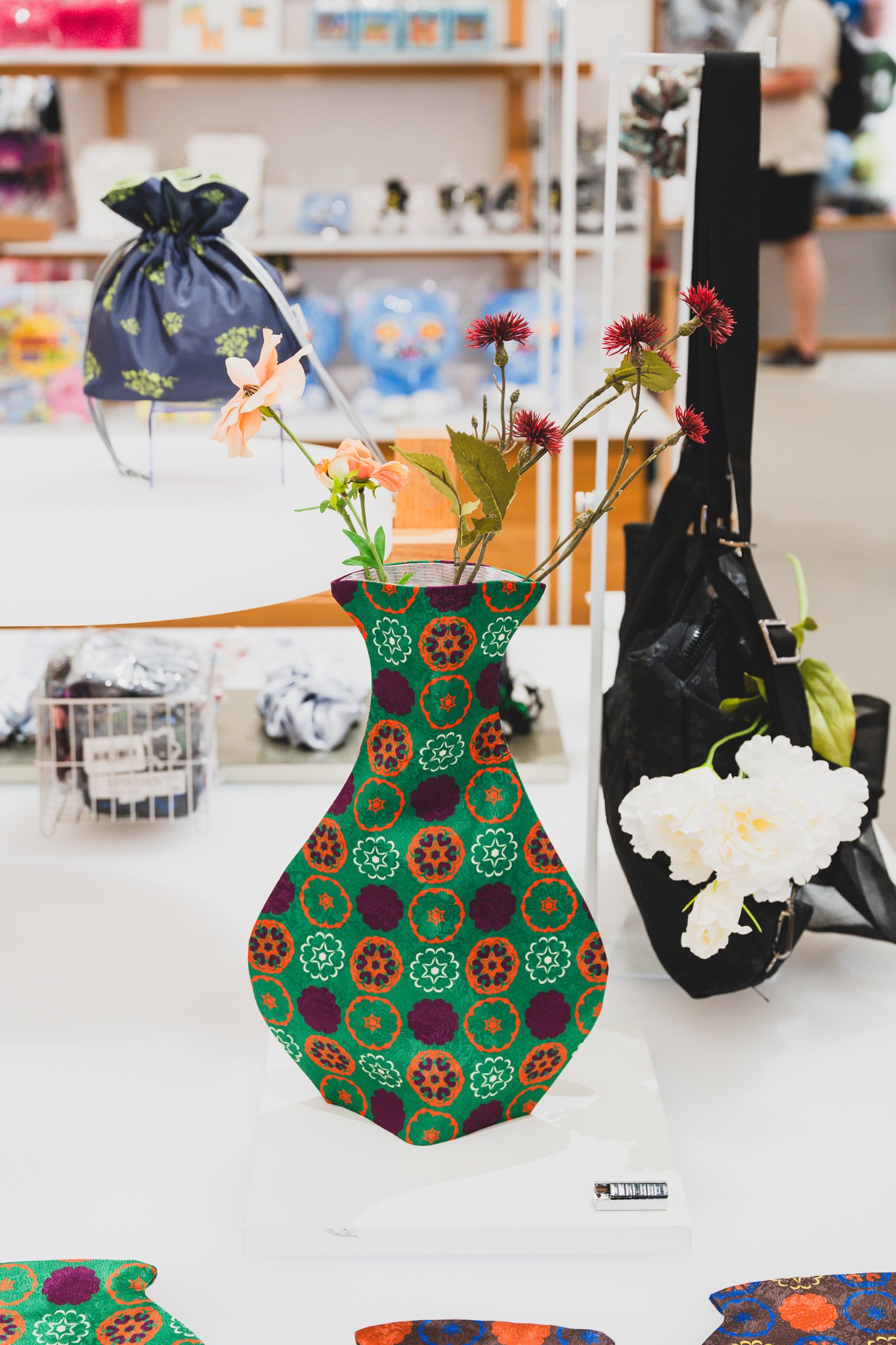 Fabric vase with OUWR pattern, shaped like a traditional ceramic vase
