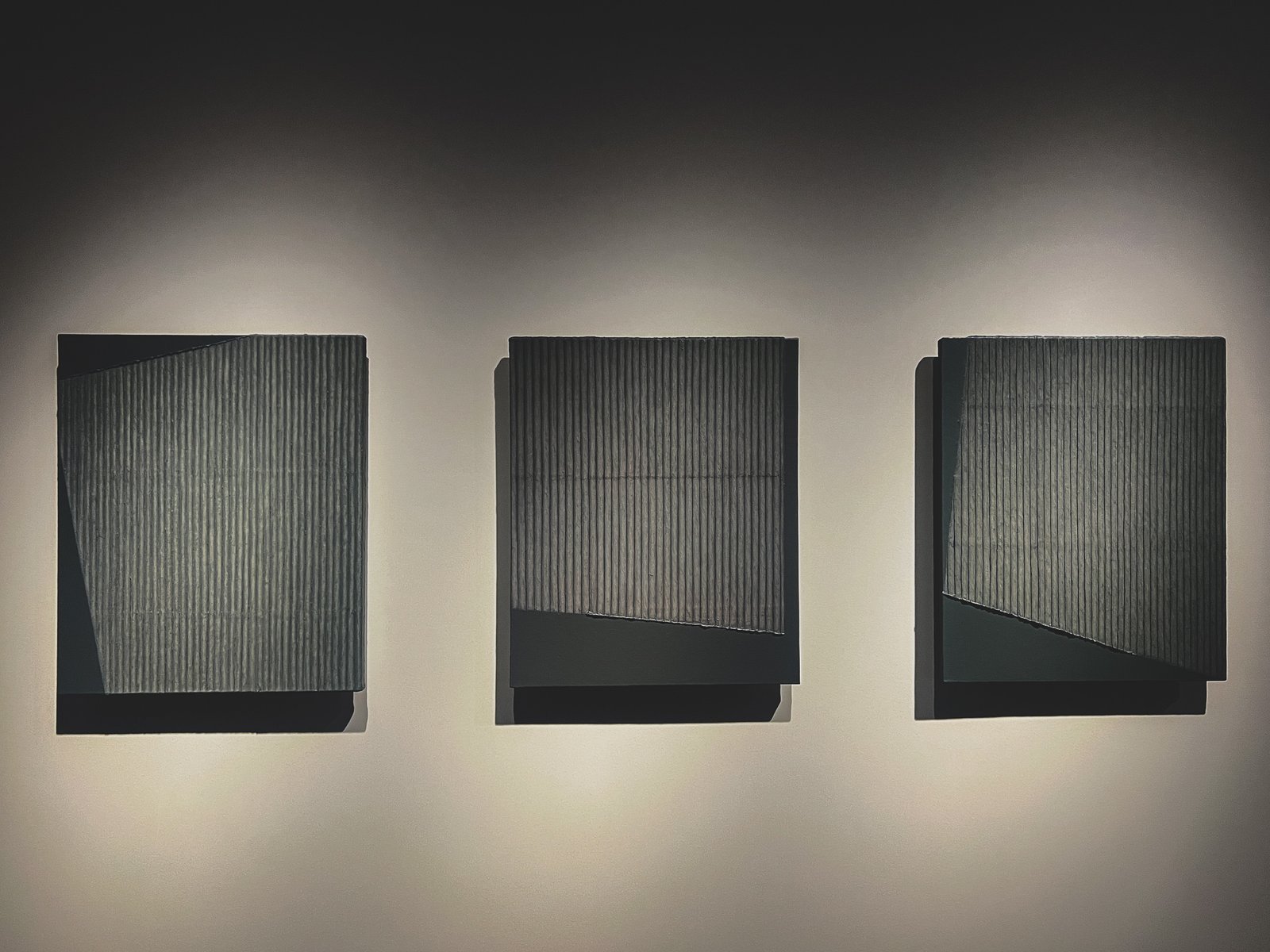 Three black hanji Ecriture works hung side by side