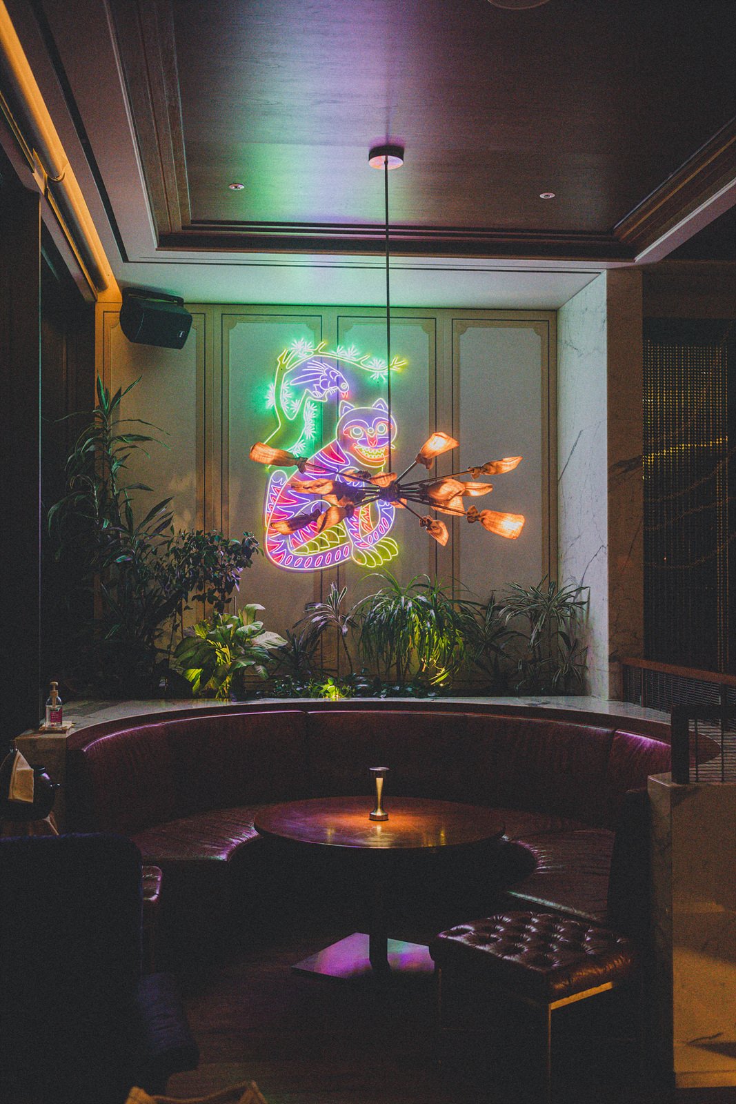 OUL, the Korean-themed cocktail bar at Four Seasons Hotel Seoul, with a neon haetae artwork and traditional lattice screens