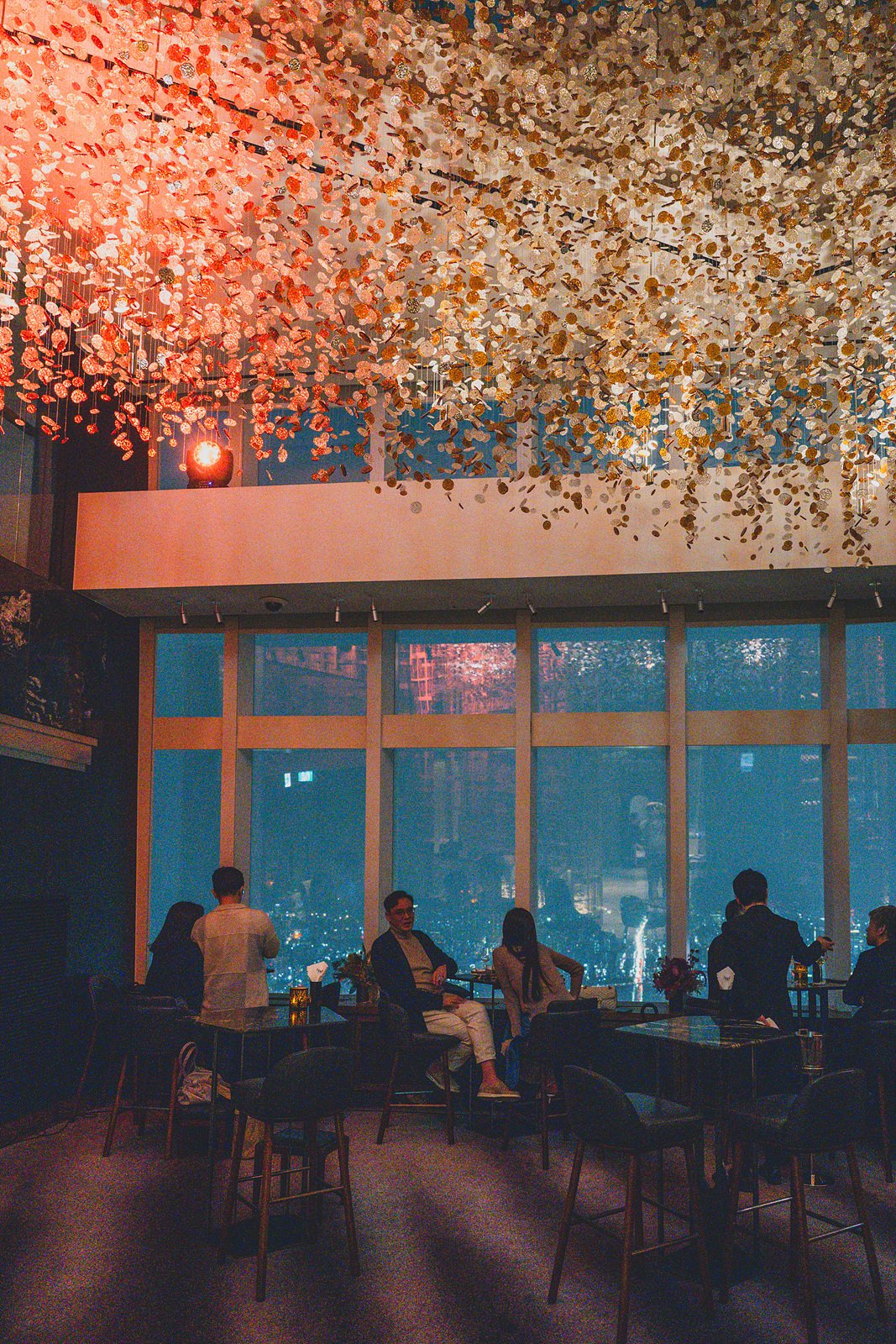 Bar 81 on the 81st floor of Signiel Seoul, with Seoul's night skyline through floor-to-ceiling windows