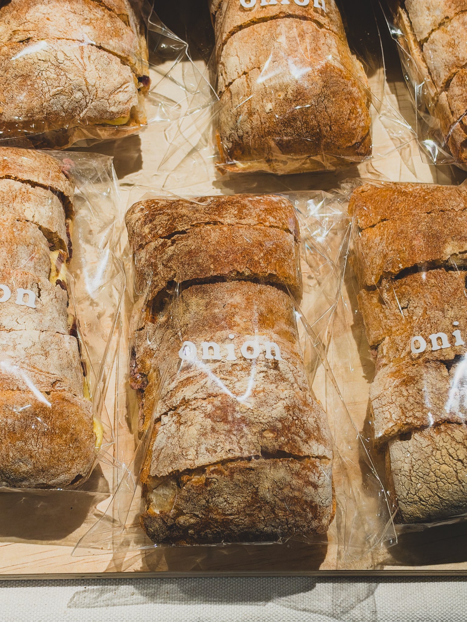 Packaged bread with the "onion" logo printed on the wrapping