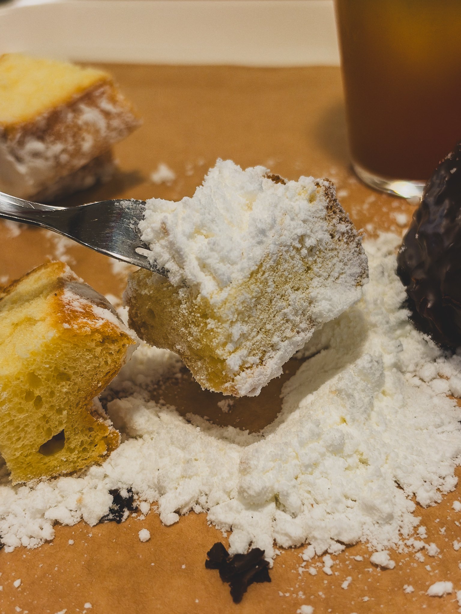 Cross-section of the pandoro showing a buttery interior under powdered sugar
